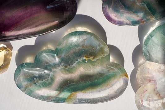 Rainbow fluorite cloud dish in emerald green with a citrine crystal point and dried pampas grass