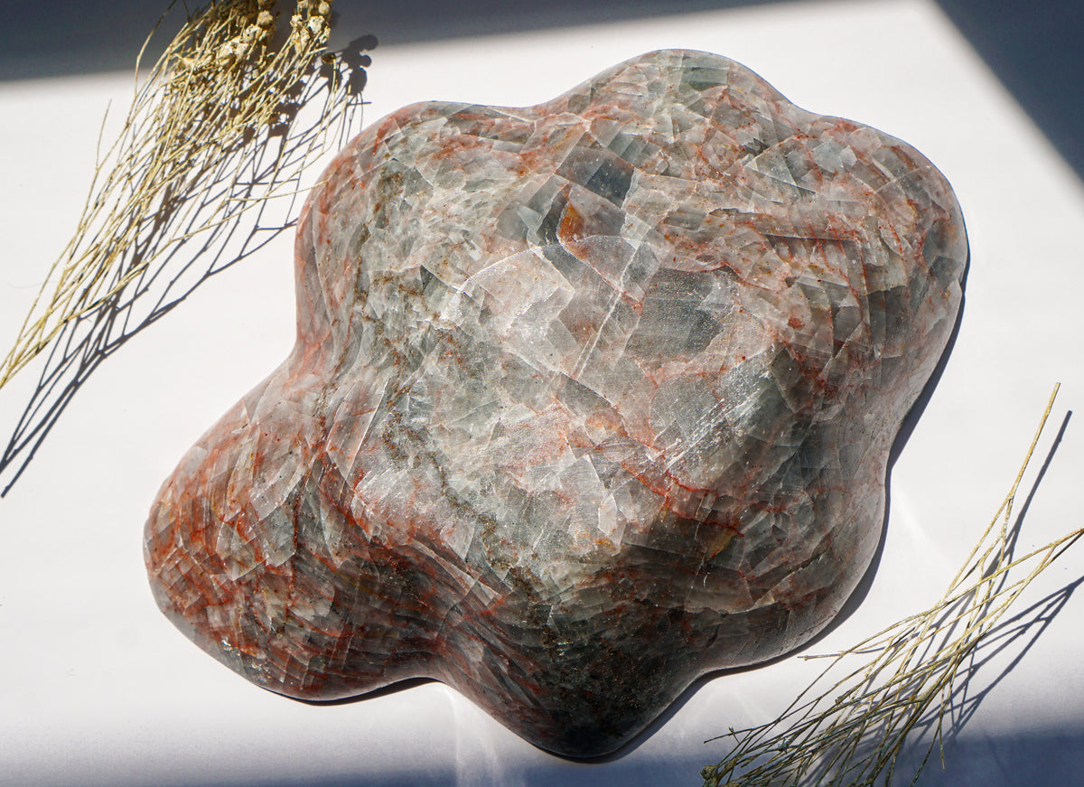 Exterior view of freeform hand carved Blue Calcite hematite bowl with scalloped star-shaped edge