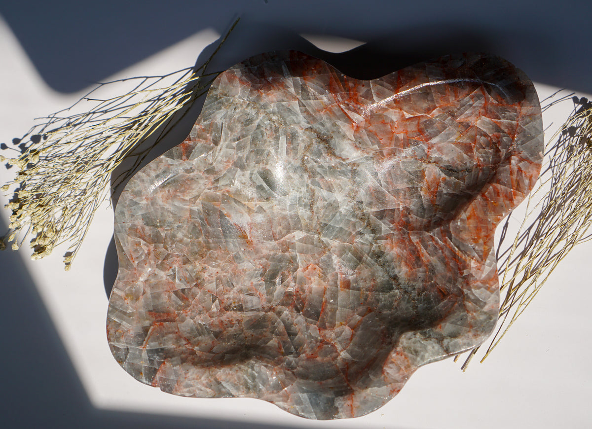 Top-down view of empty Blue Calcite hematite bowl with freeform scalloped edge