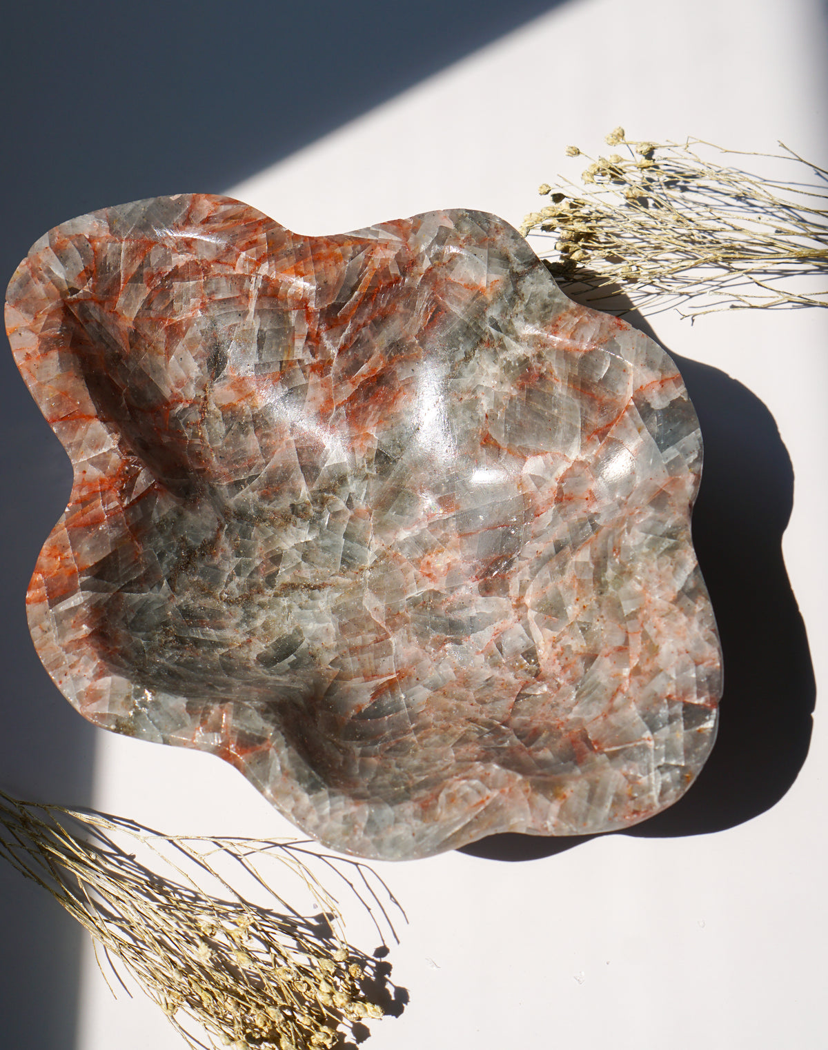 Empty Blue Calcite hematite bowl in vertical orientation showing full scalloped shape