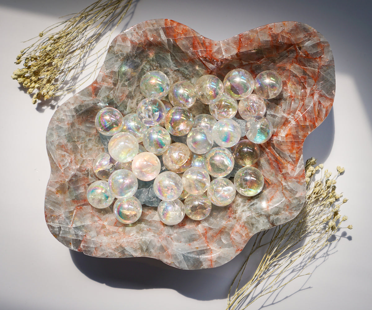 Blue Calcite hematite bowl filled with iridescent angel aura quartz spheres