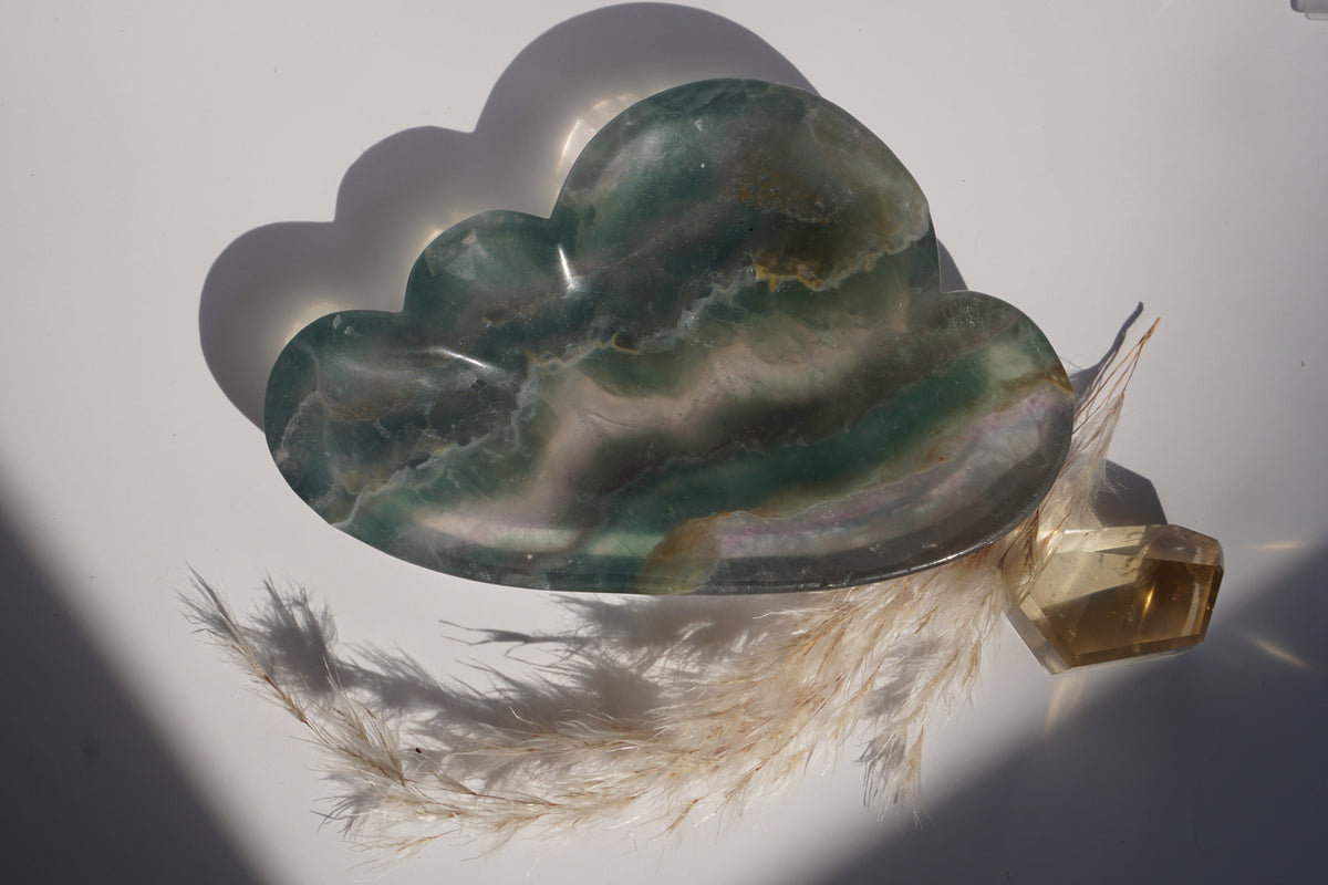 Close-up of rainbow fluorite cloud dish in emerald green banding