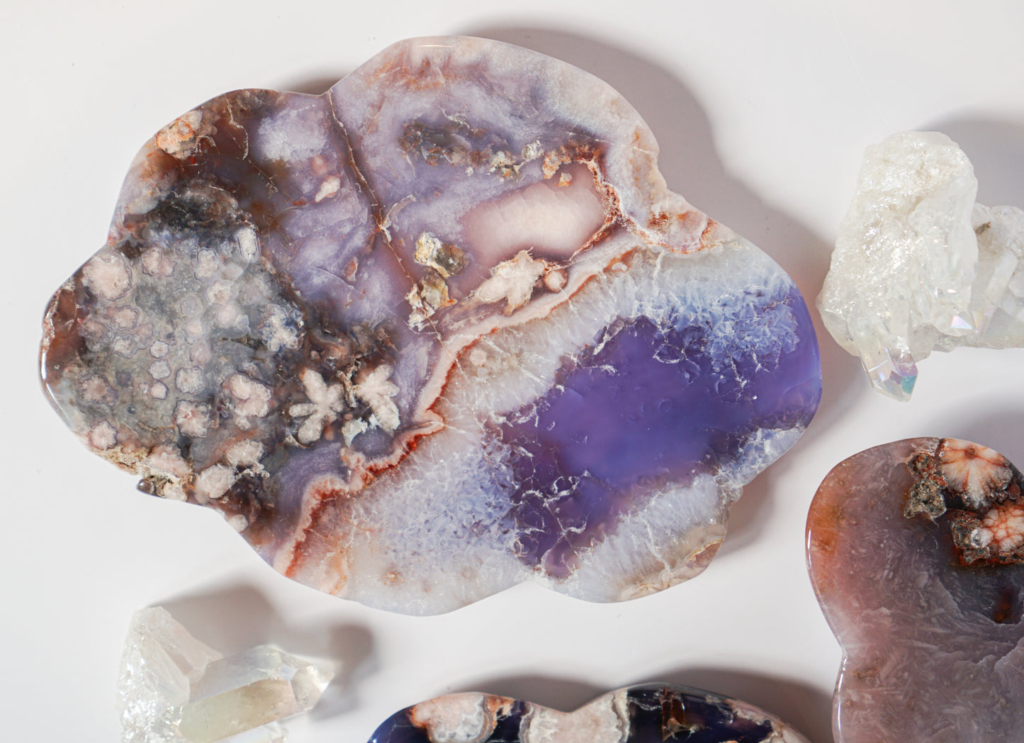 Blue Flower Agate dish shown with quartz clusters and sibling agate dishes for scale